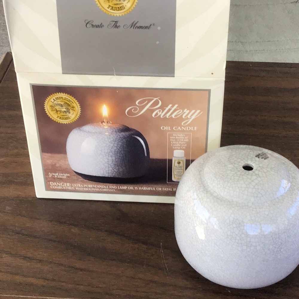 Pottery oil candle.  New W/O tags.